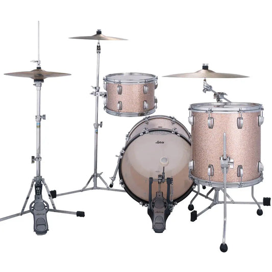 A 5-piece drum kit with a light pink glitter finish on the drums and silver hardware, shown with matching silver cymbals and stands on a white background.