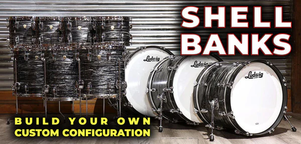 A row of Ludwig drum shells, including toms and bass drums, is displayed in front of a corrugated metal wall with text promoting custom shell bank configuration.